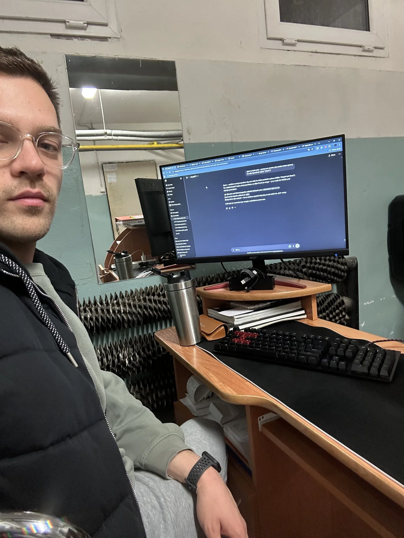 Matej building dreamhubb with ChatGPT open on the monitor at his basement workstation