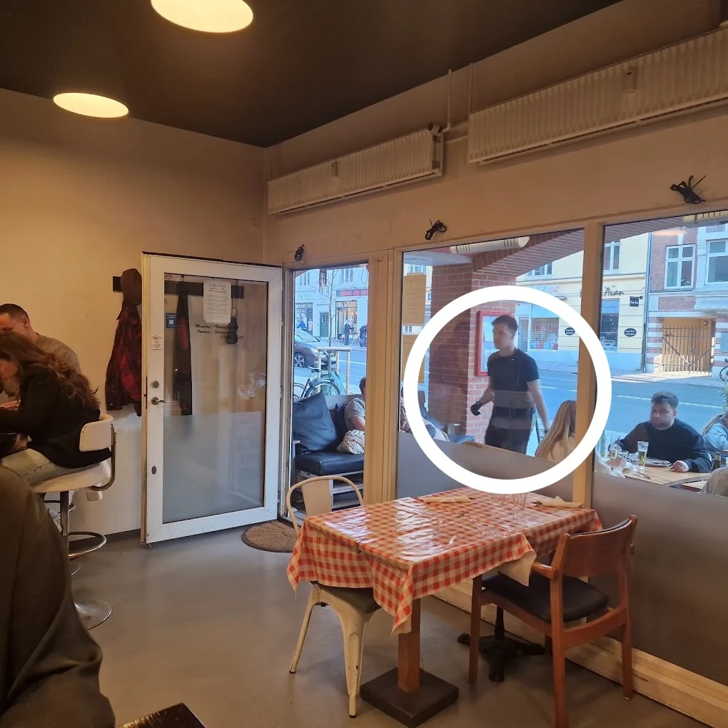 Inside Pizzeria La Carmela in Valby, with Matej marked by a white circle